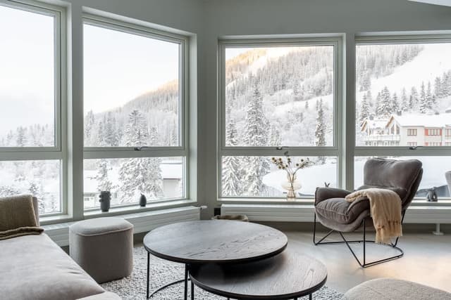Ski-in ski-out apartment in Åre with sleek interior, fully equipped kitchen, modern bathroom and mountain views
