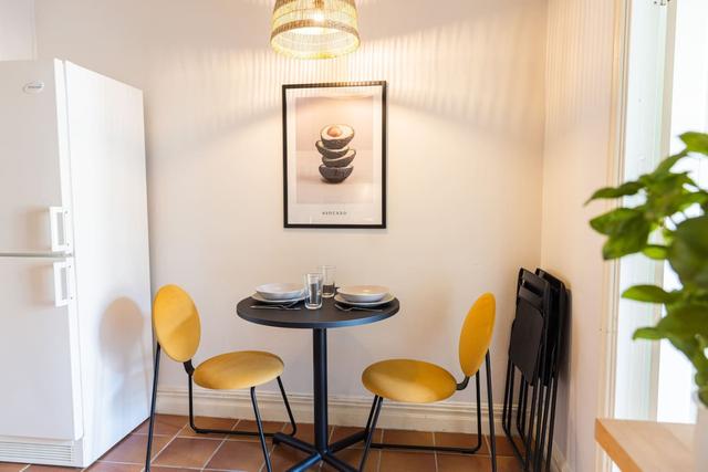 Living room with a convertible sofa in central Gothenburg apartment.