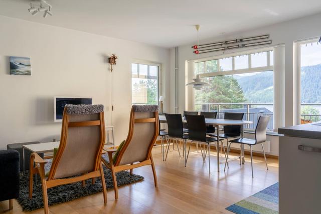 Spacious kitchen in Åre apartment with balcony access