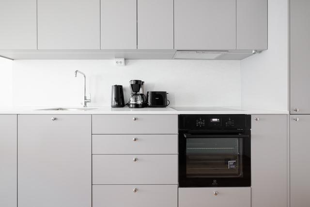 Bright living room, modern kitchen, cozy master bedroom and sleek bathroom in SoFo apartment, Stockholm
