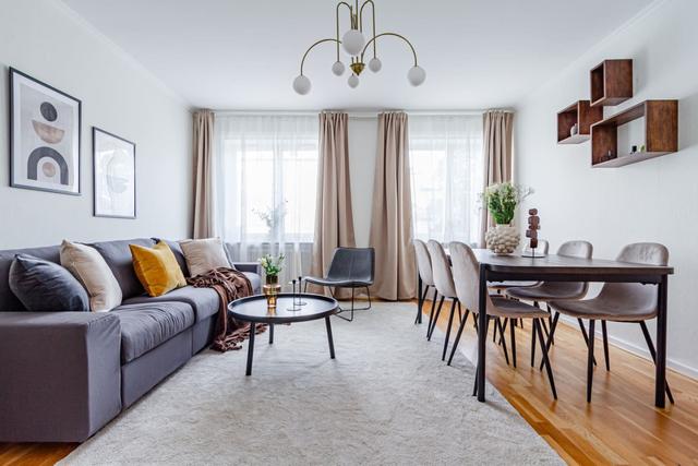 Living room with dining area in Sundbyberg