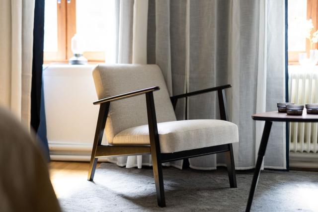 Cozy dining area for two by the large window in Gothenburg.