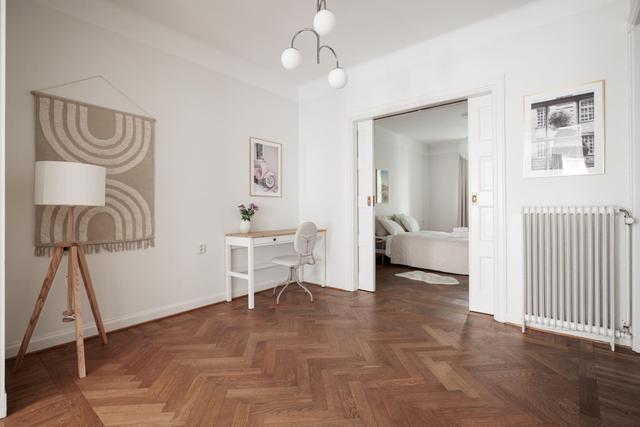 Third-floor living room with large windows in Vasastan