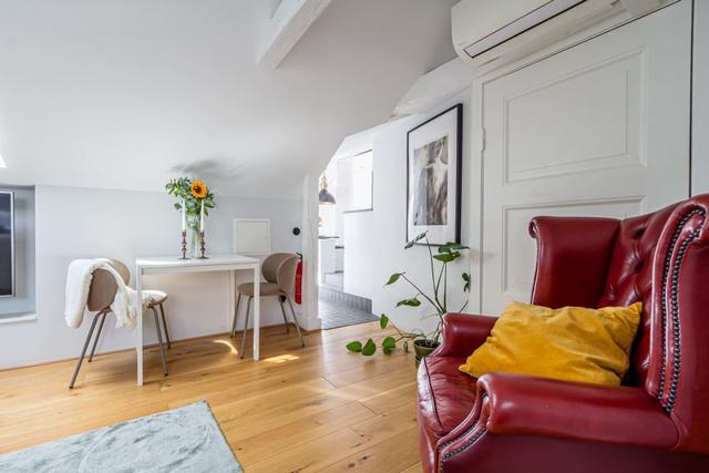 Top-floor apartment in Södermalm with city views and modern amenities.