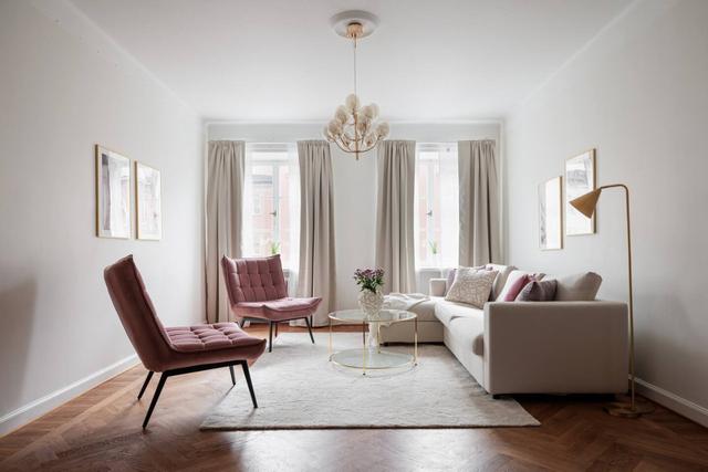 Third-floor living room with large windows in Vasastan