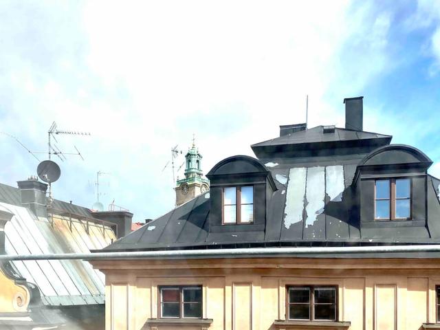 Bright attic apartment in Old Town Stockholm with modern design.