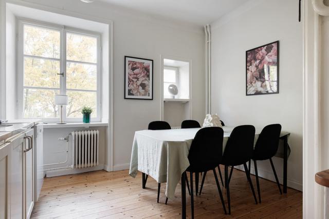 Living room in Vasastan apartment with large windows