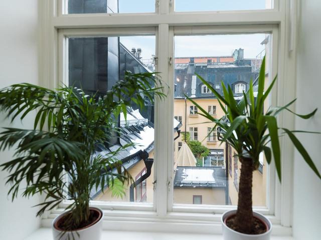 Bright attic apartment in Old Town Stockholm with modern design.