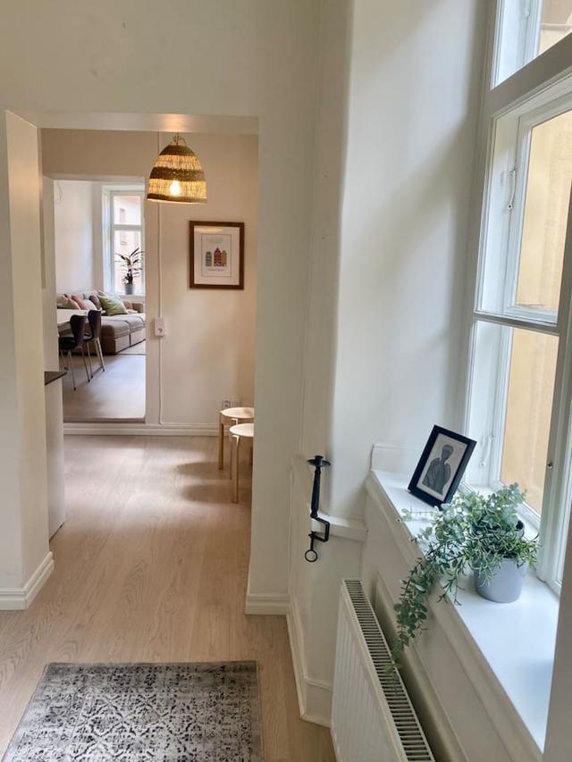 Cozy master bedroom with antique fireplace in Stockholm Old Town