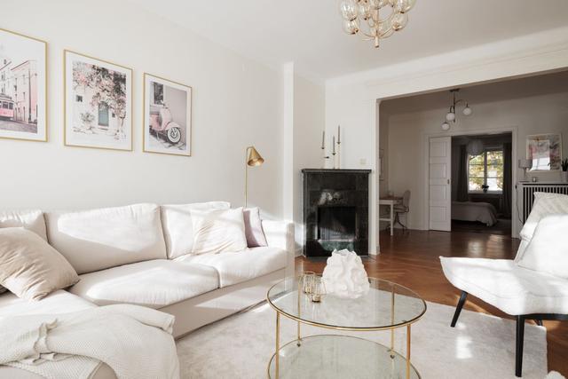 Living room in Vasastan apartment with large windows