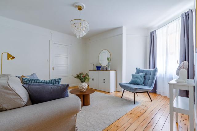 Spacious living room with sofa bed in Vasastan, Stockholm.