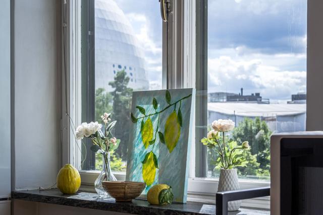 Comfortable living room with balcony access in Globen apartment