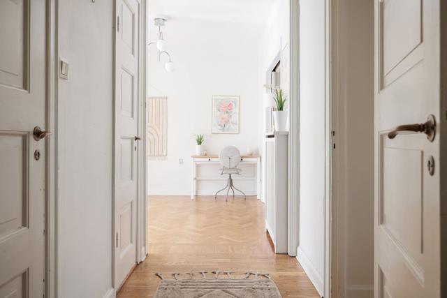 Living room in Vasastan apartment with large windows