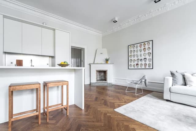 Renovated apartment in Östermalm, Stockholm with balcony and herringbone flooring.