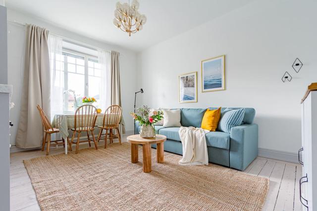 Bright open area combining kitchen and living room in chic apartment