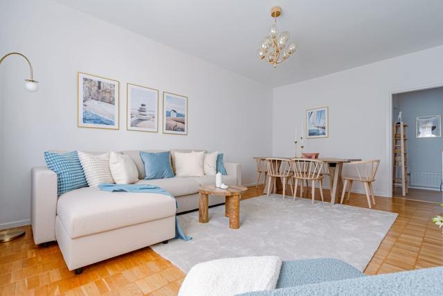 Bright living room in Sundbyberg apartment.