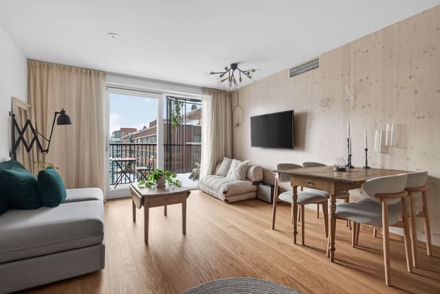 Interior of a light-filled Kungsholmen apartment in Scandinavian style with wooden details