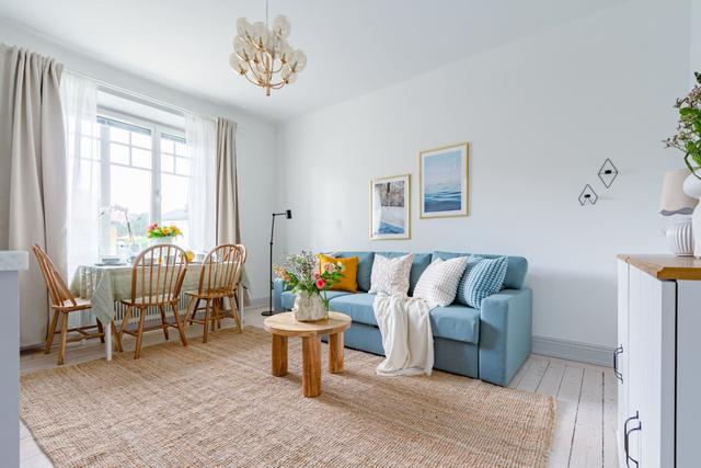 Bright open area combining kitchen and living room in chic apartment