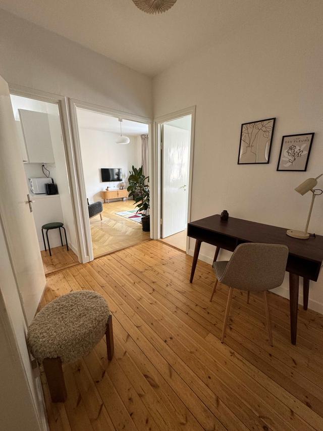 Cozy one-bedroom apartment interior in Sundbyberg with workspace and separate kitchen