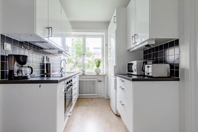 Living room with dining area in Sundbyberg