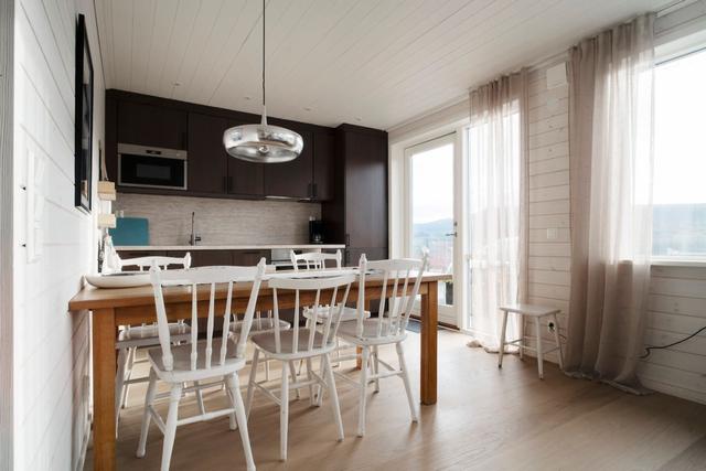 Cozy living room in Tegefjäll apartment with natural light.