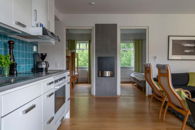 Spacious kitchen in Åre apartment with balcony access