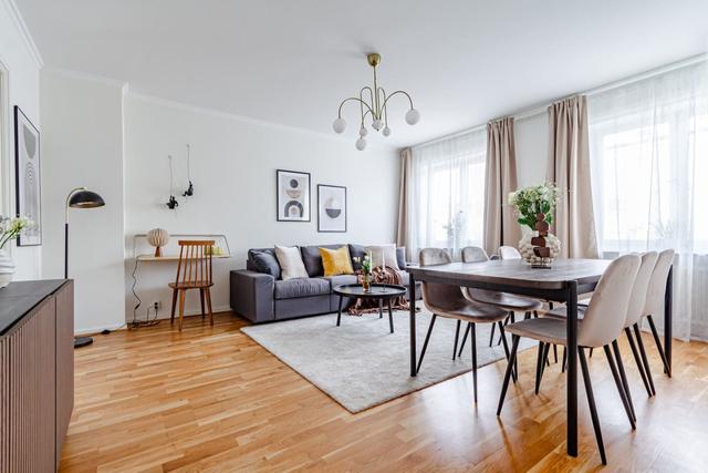 Living room with dining area in Sundbyberg