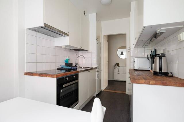 Spacious kitchen with dining area in Solna apartment