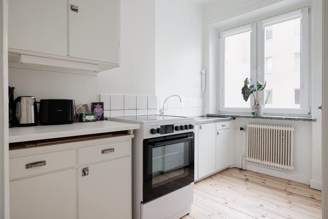 Bright interior of a comfortable Sundbyberg flat near Stockholm surrounded by greenery