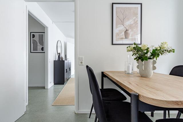 Living room with sofa bed and office space in Södermalm apartment