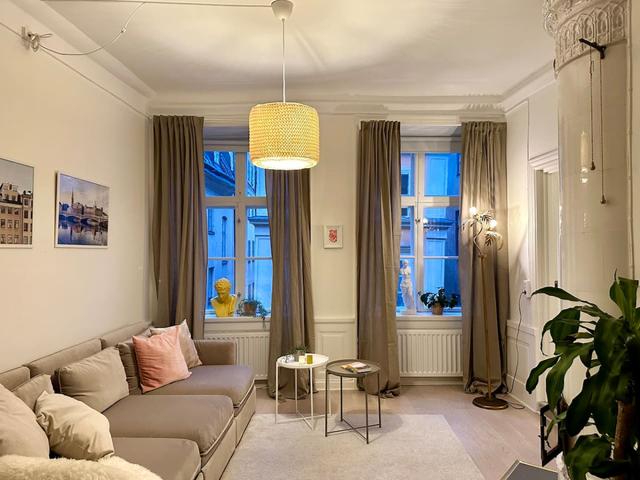 Cozy master bedroom with antique fireplace in Stockholm Old Town