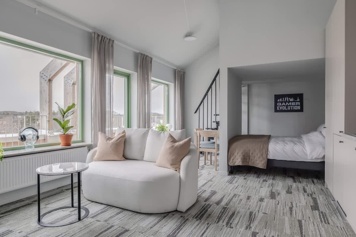 Studio stay at HomeX Hotel Täby with private balcony, mezzanine desk, shared kitchen and lounge