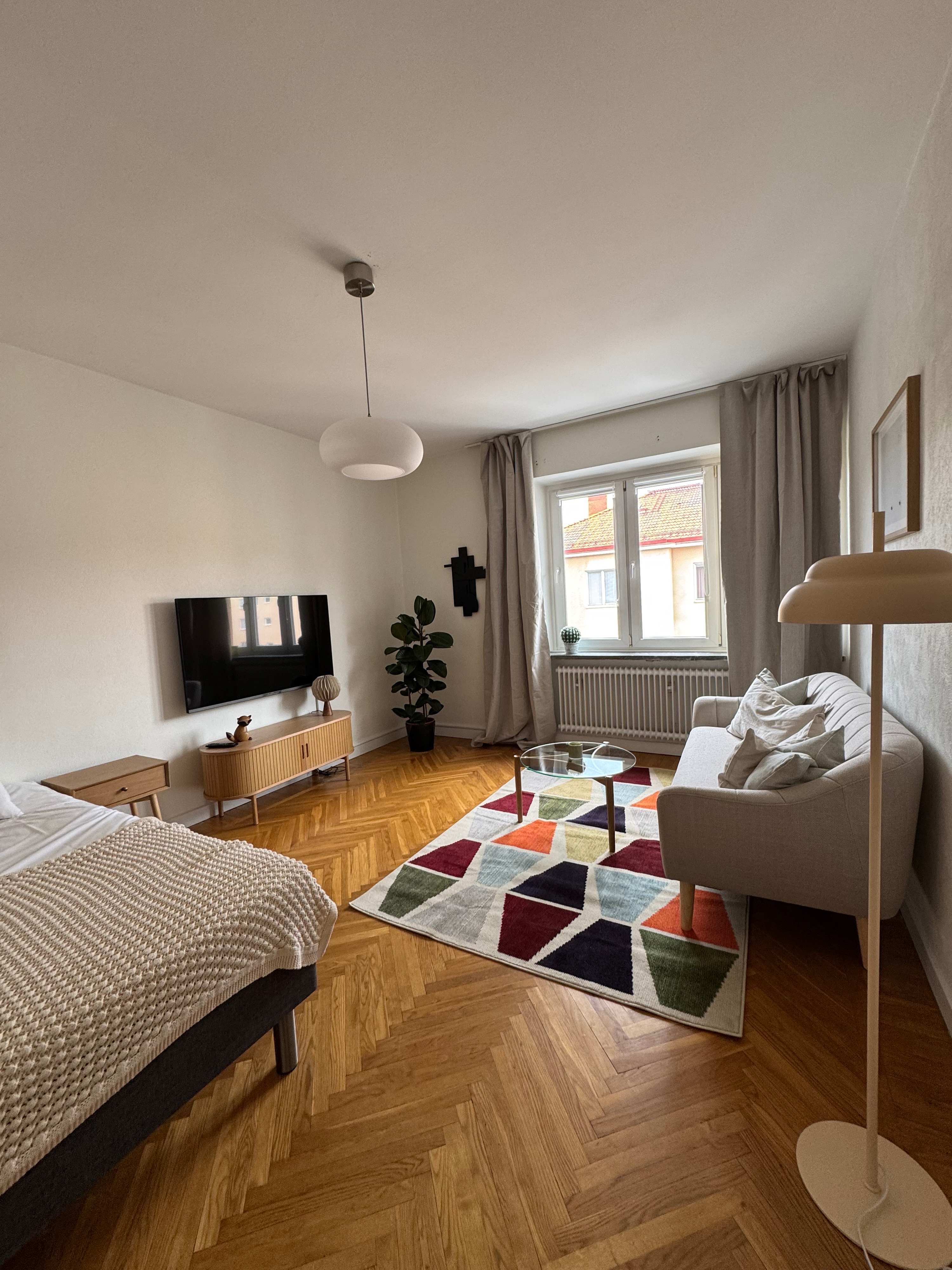 Cozy studio interior, kitchenette view, bed area, Sundbyberg Stockholm suburb.
