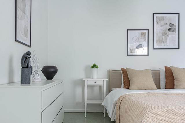 Living room with sofa bed and office space in Södermalm apartment