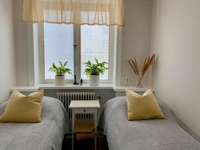 Master bedroom with king size bed in Södermalm apartment