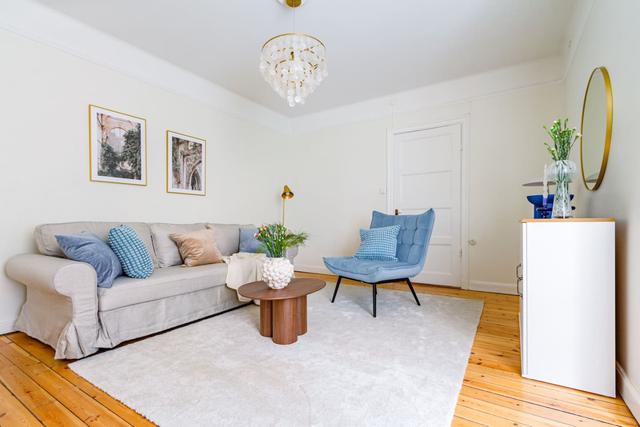 Spacious living room with sofa bed in Vasastan, Stockholm.