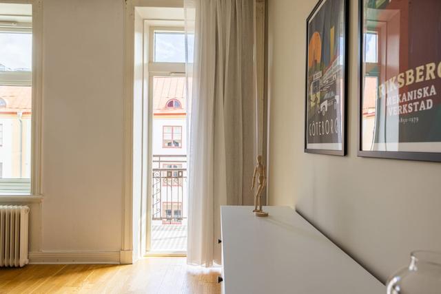 Living room with a convertible sofa in central Gothenburg apartment.