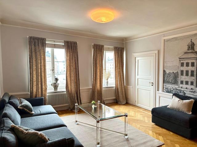 Panoramic view of living room in Old Town apartment