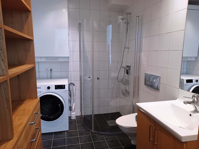 Central Åre apartment close to ski lifts and village restaurants, with ski storage and free garage parking