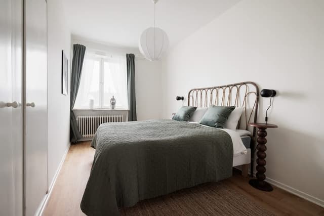 Balcony view in Sundbyberg apartment; Fully equipped kitchen in Sundbyberg; Cozy bedroom with double bed in Sundbyberg