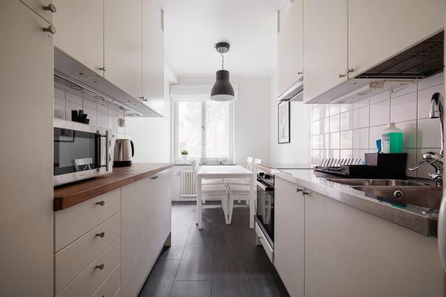 Spacious kitchen with dining area in Solna apartment