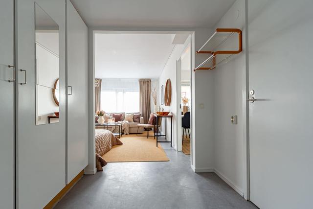 Living room with sofa bed in Södermalm studio apartment.