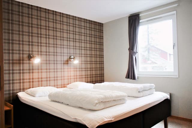 Familjelägenhet för skidsemester i Björnen med bastu, tre badrum och skidförråd nära skiduthyrning