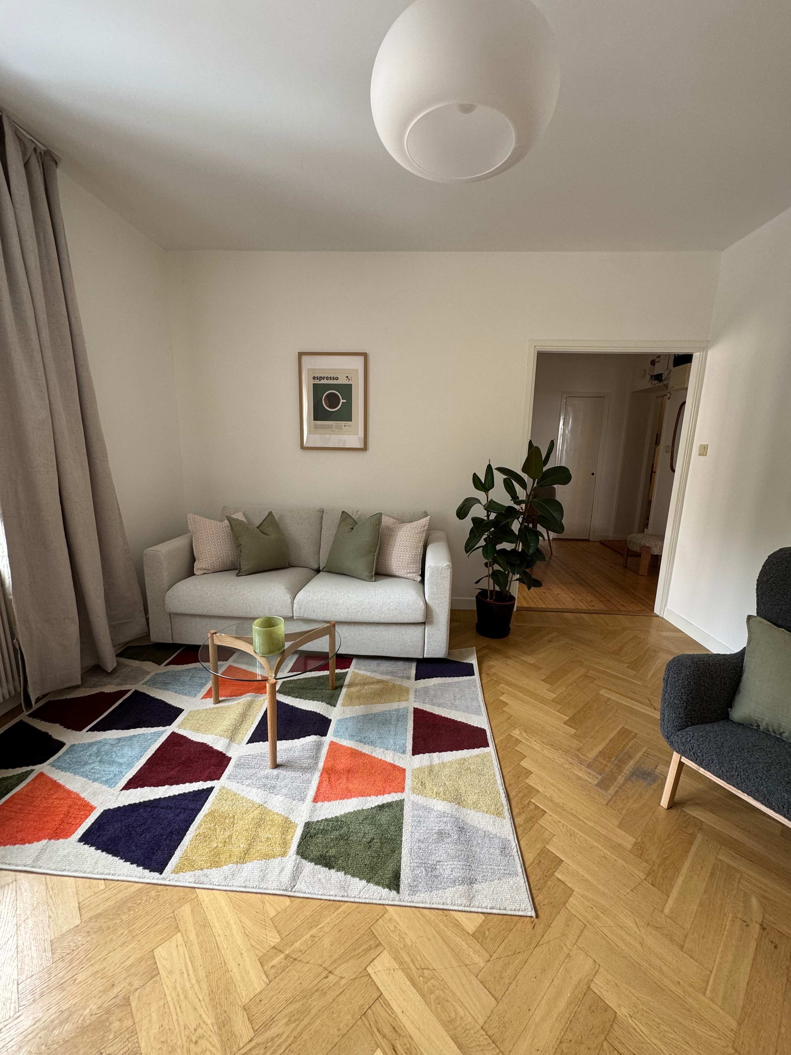 Cozy one-bedroom apartment interior in Sundbyberg with workspace and separate kitchen